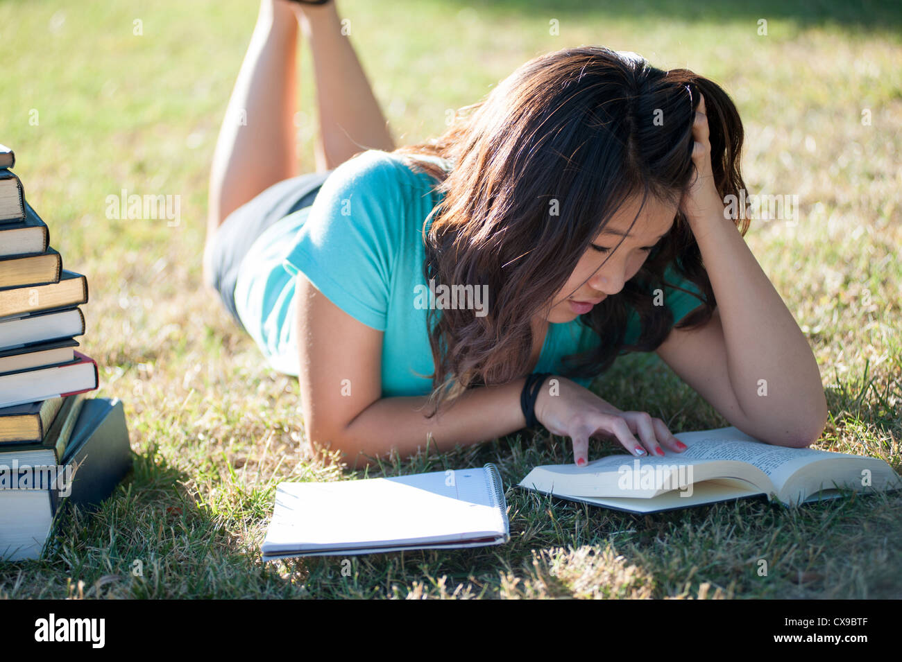 Young woman studying outside Stock Photo