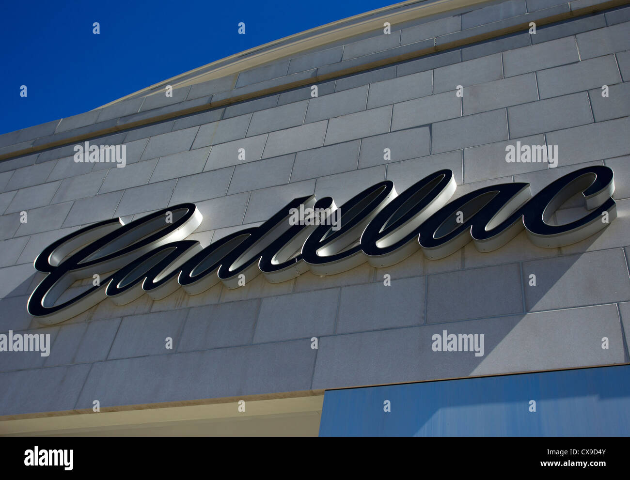 A sign above a Cadillac dealership Stock Photo Alamy