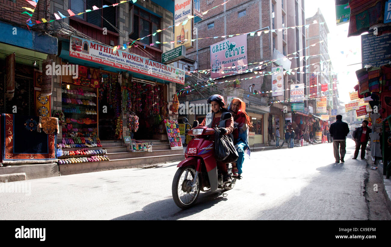 Girls on a moped in Thamel, Kathmandu, Nepal Stock Photo