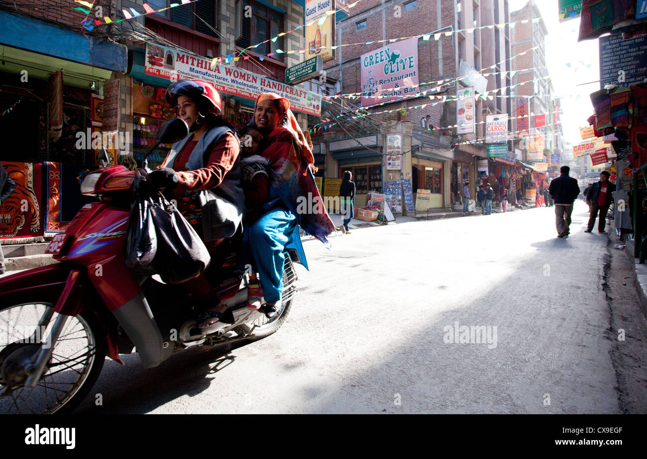 Girls on a moped in Thamel, Kathmandu, Nepal Stock Photo