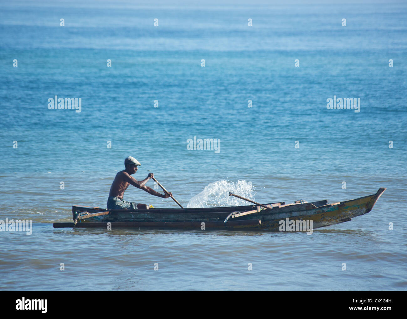 Man fishing in a boat, Dili, East Timor Stock Photo