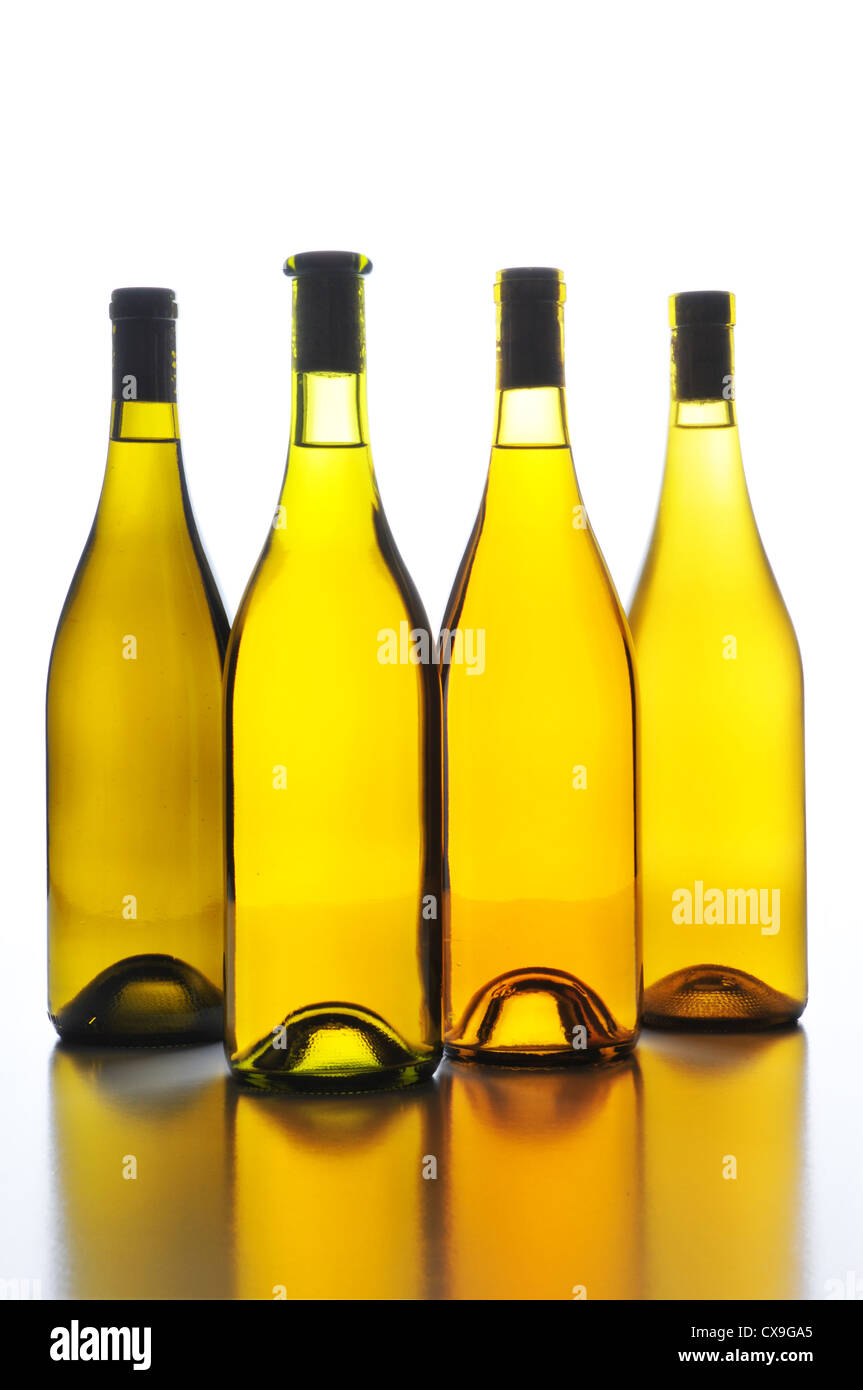 Four Wine Bottles no labels with Back Light and reflections Stock Photo