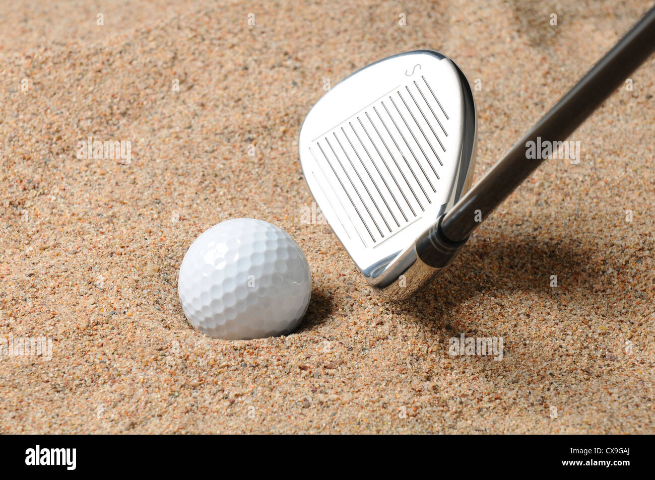 Golf ball in sand High Resolution Stock Photography and Images Alamy