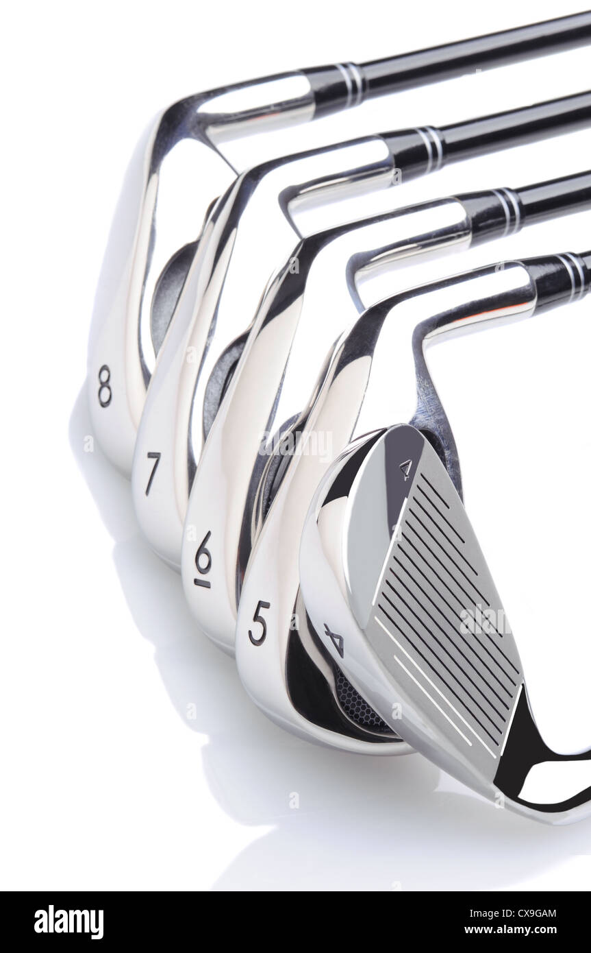 Set of Five Golf Irons on a white background with reflection. Stock Photo