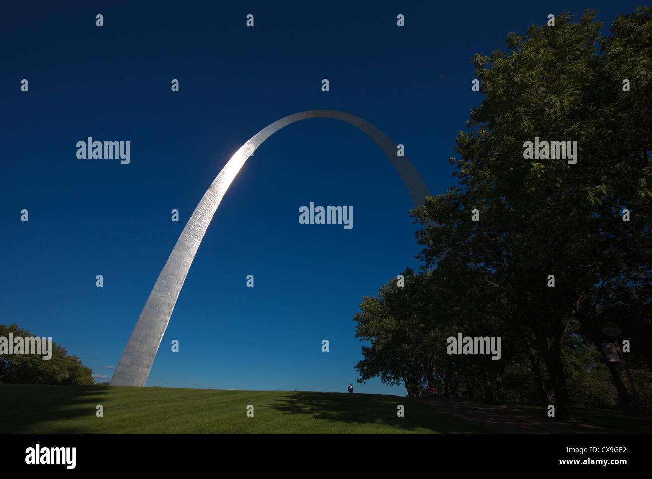 The famous St. Louis arch rises high over downtown and the Mississippi River. Stock Photo