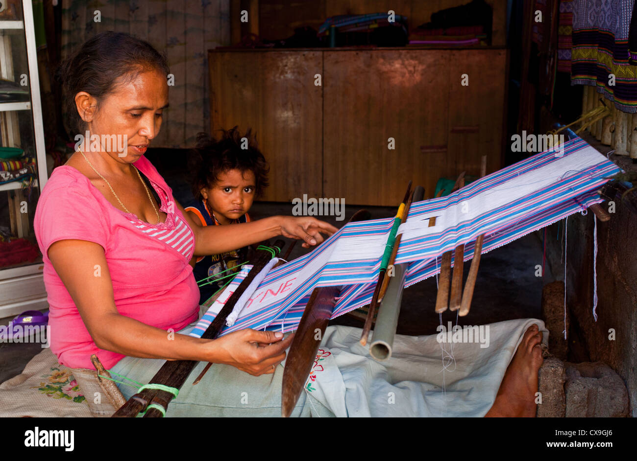 Woman weaving colourful tais fabric on a loom, Dili, East Timor Stock ...