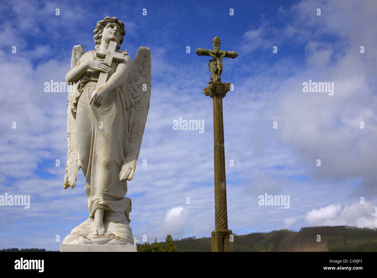 Angel with a cross in a cemetery near Cee in Galicia, Spain. Stock Photo