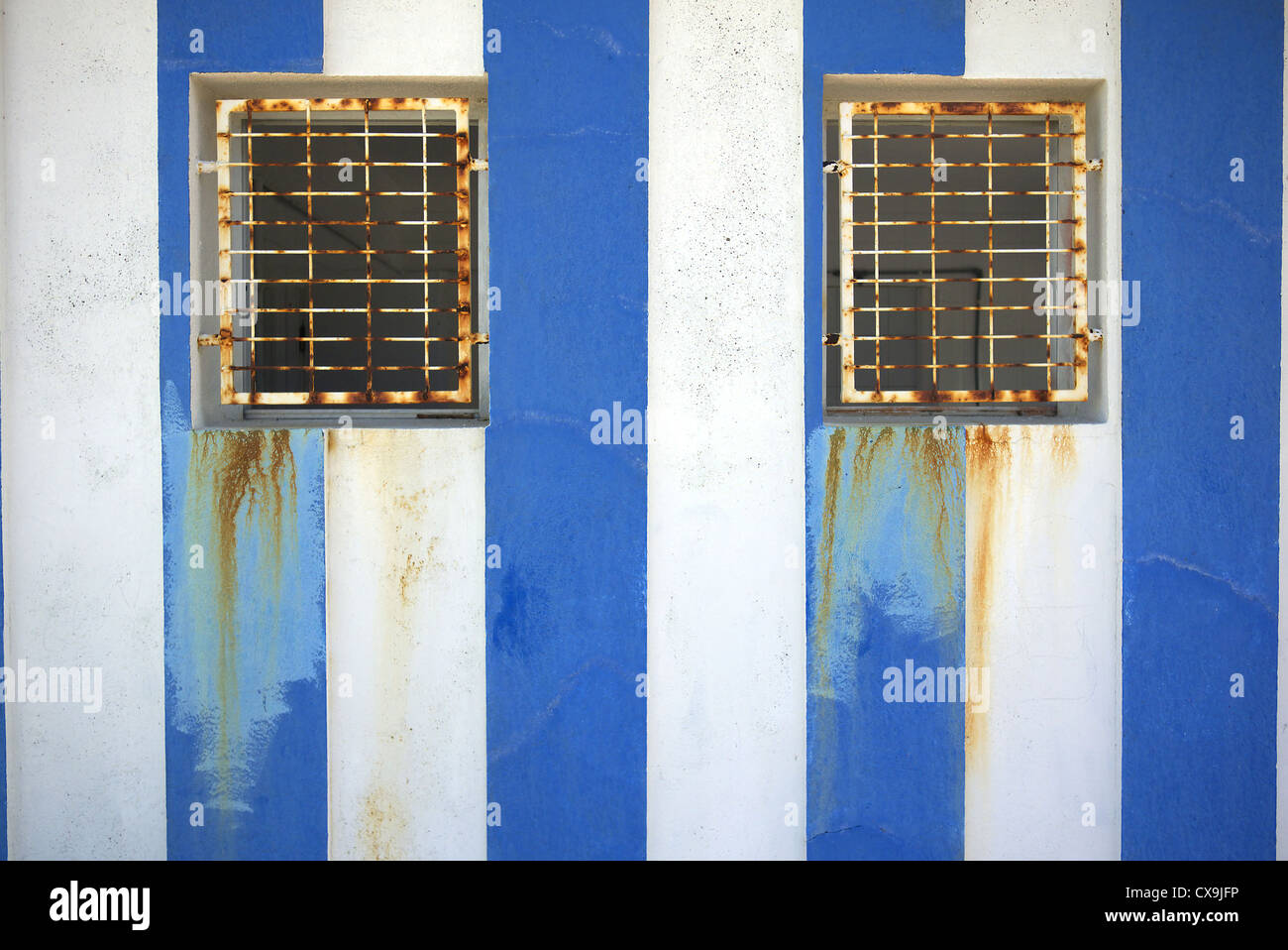 Blue and white striped toilet block by the beach. Spain. Stock Photo