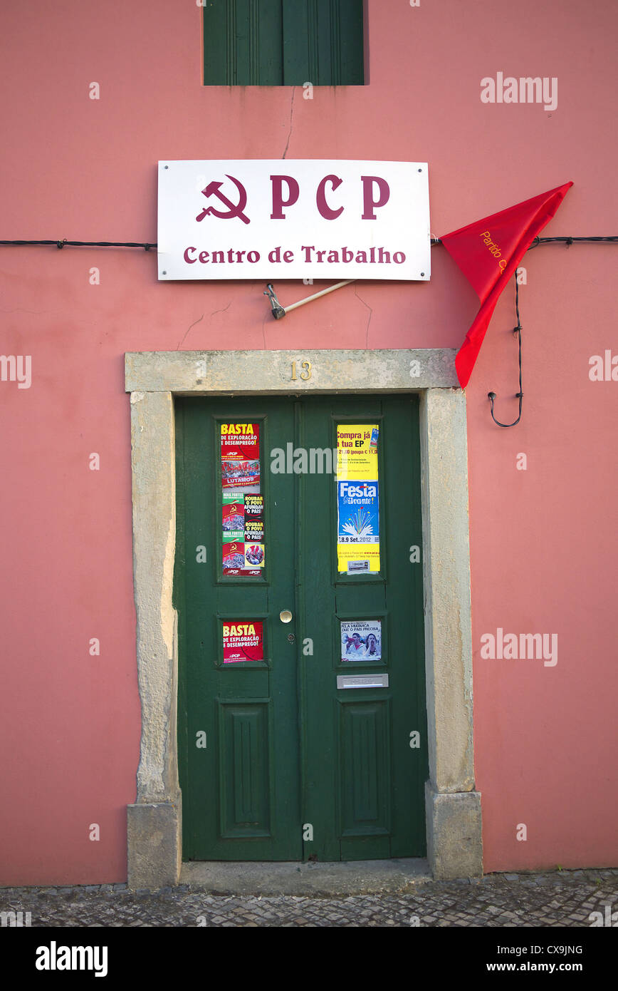 Members of the Portuguese Communist Party Youth carry flags and