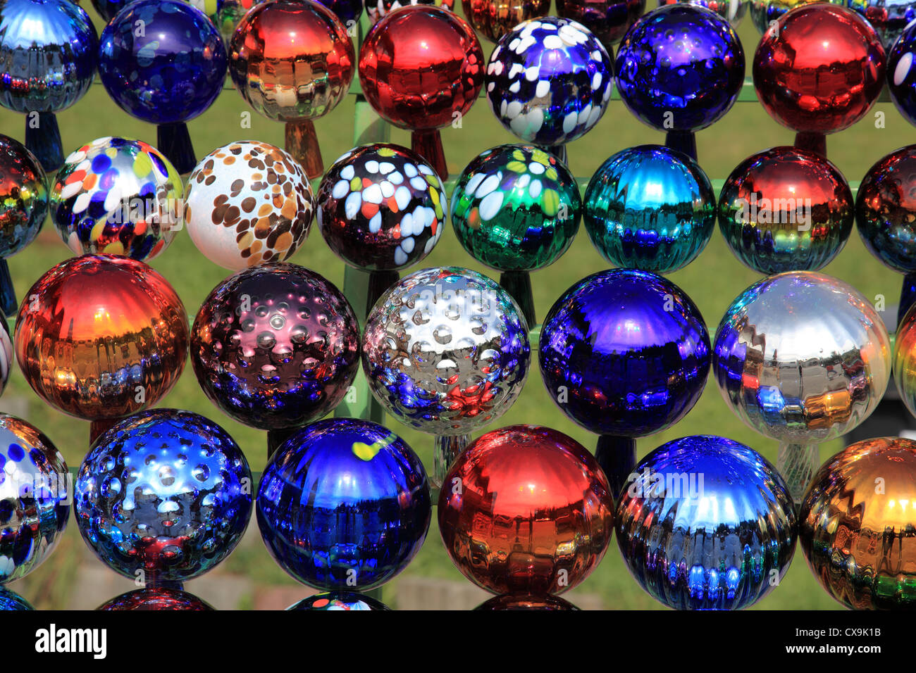 collection of colored glass balls decoration in garden. Photo by Willy