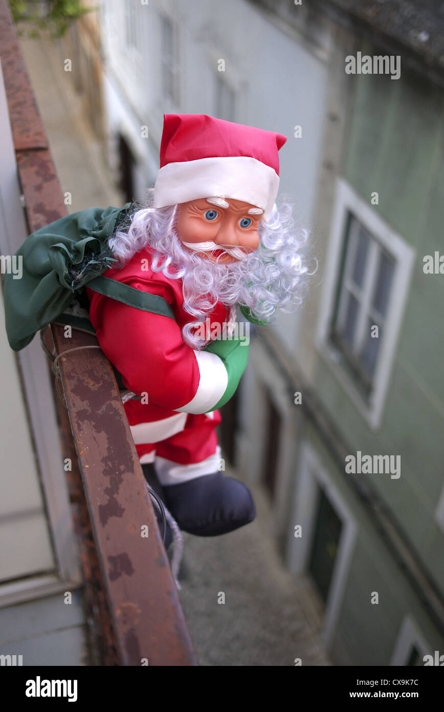 Santa Claus attached to a balcony. Stock Photo