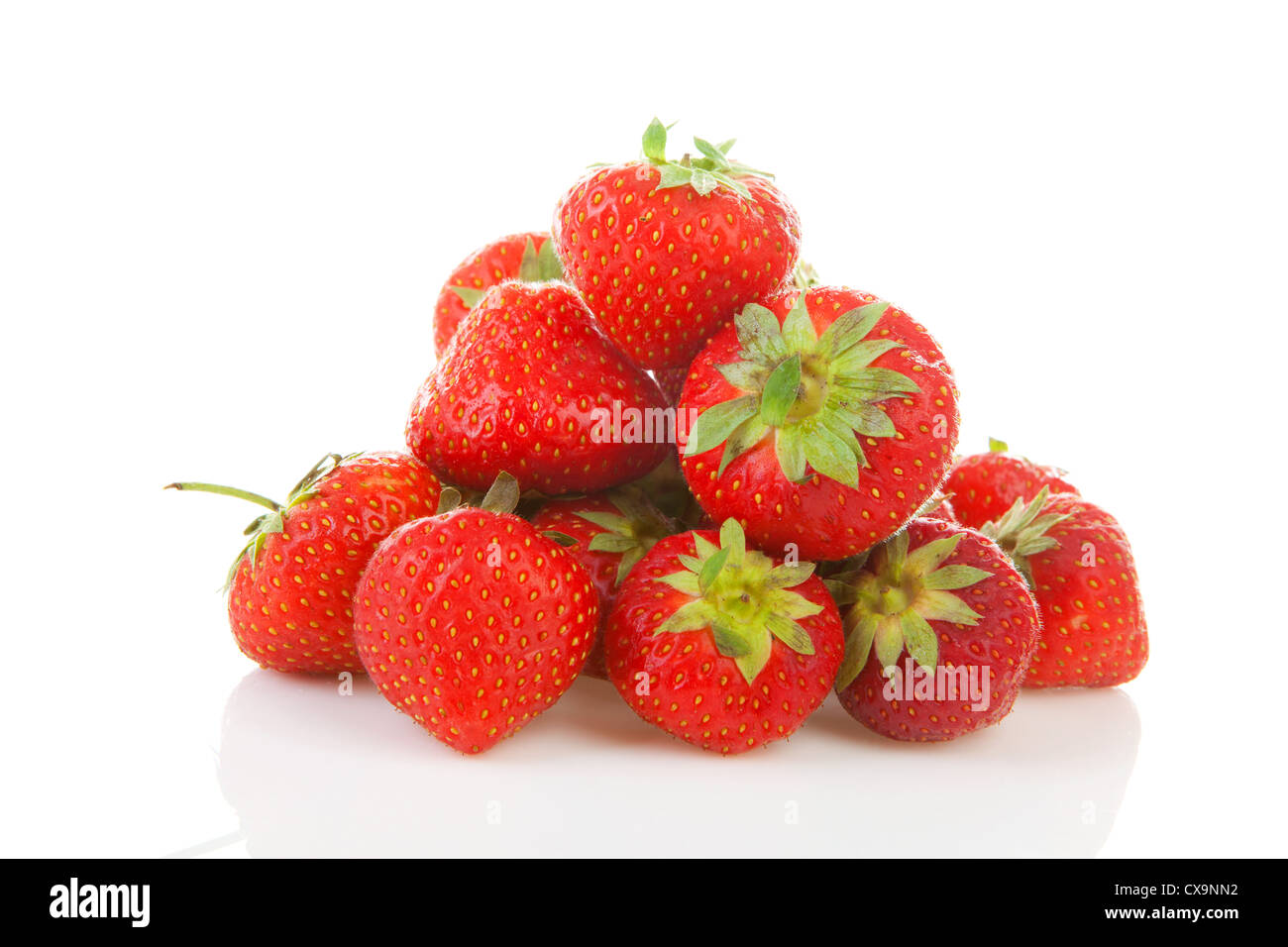 Pile of fresh strawberries in closeup over white background Stock Photo ...