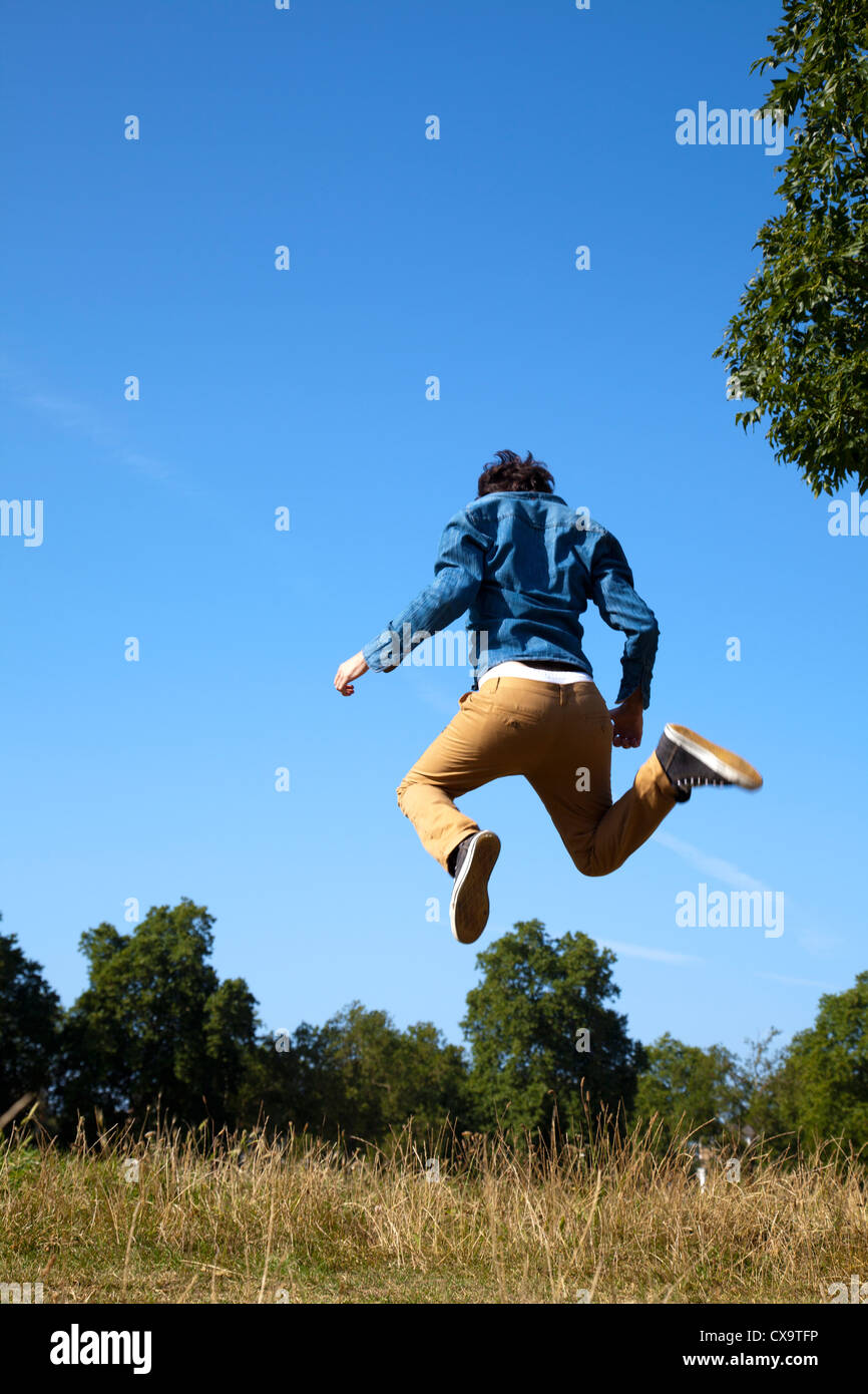 Man Jumping Skywards Stock Photo