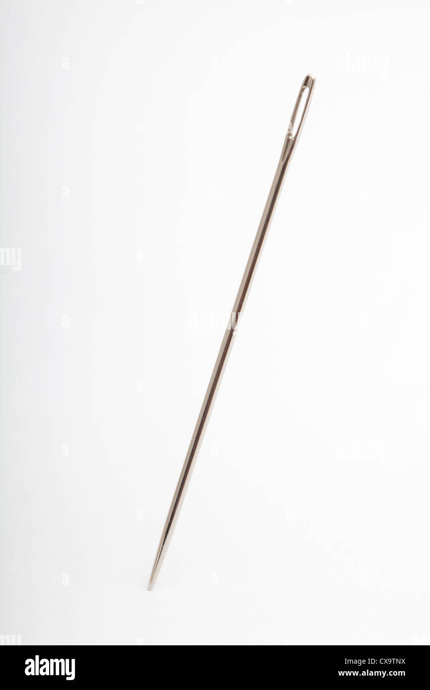 metal needle inserted into the white background Stock Photo Alamy