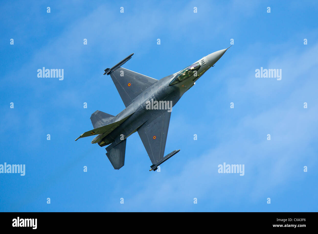 An F-16 figher jet performs at an airshow Stock Photo