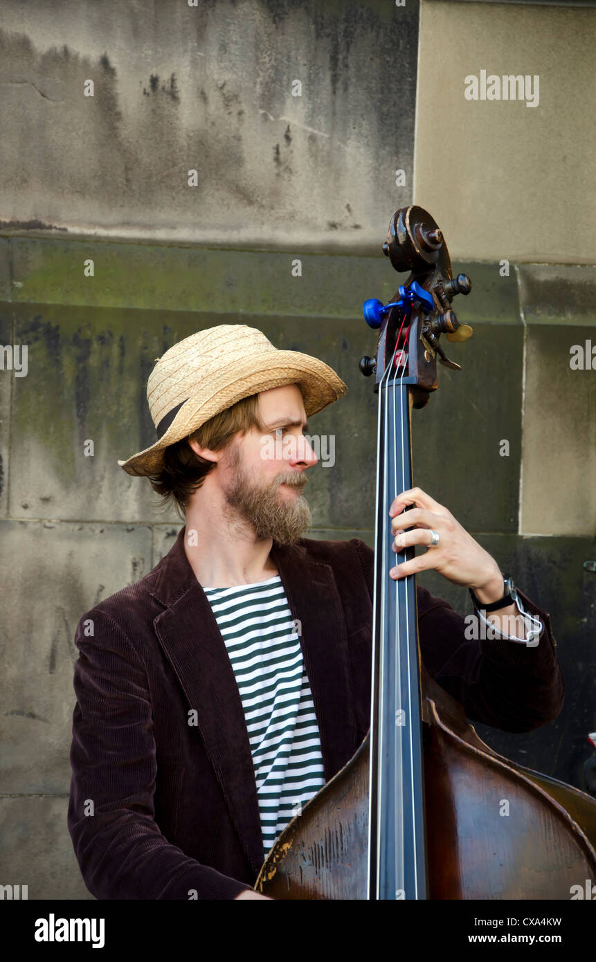 Double bass player with Jen and the Gents busking on the Royal Mile