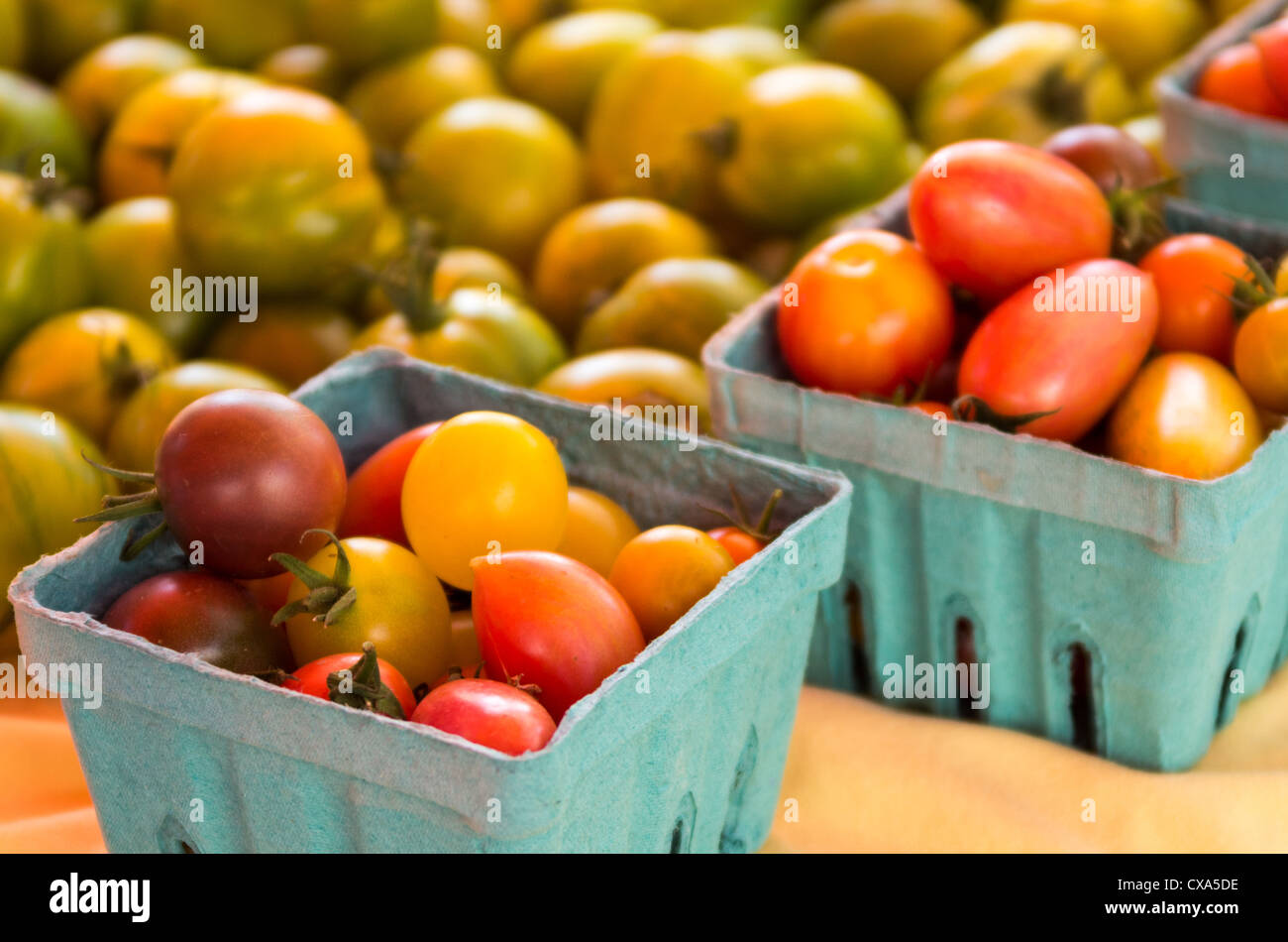 Baskets of cherry tomatoes on display at the farmers market Stock Photo ...