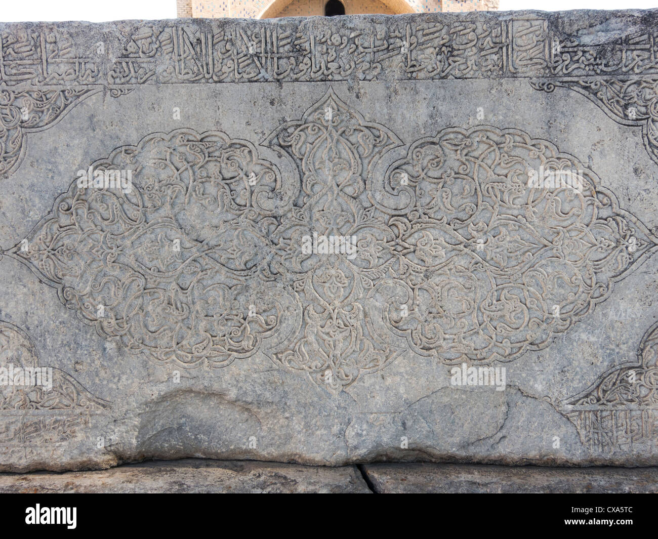 detail of arabesque carving on stone Quran stand, Bibi Khanum mosque, Samarkand, Uzbekistan Stock Photo