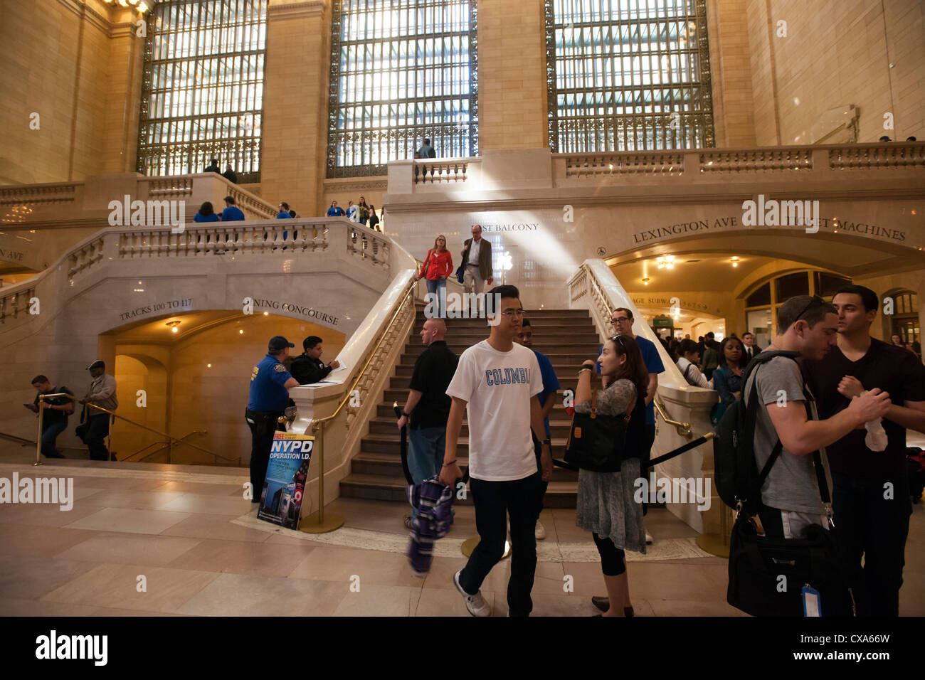 Customers leave the Apple store in Grand Central Terminal with their purchases on the day the iPhone 5 is released Stock Photo