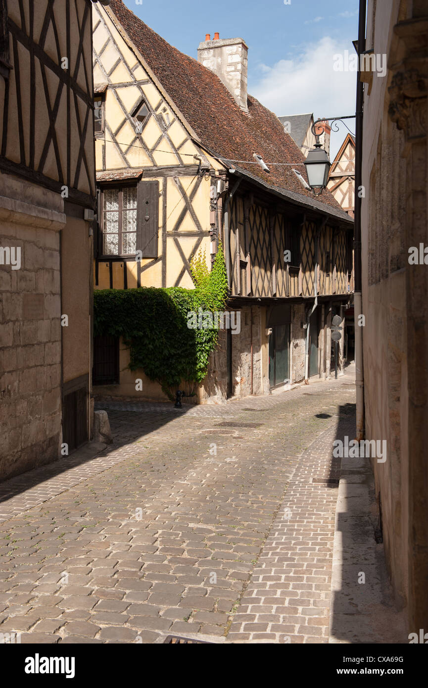 View of cobbled street with half timbered houses in Bourges France Stock Photo