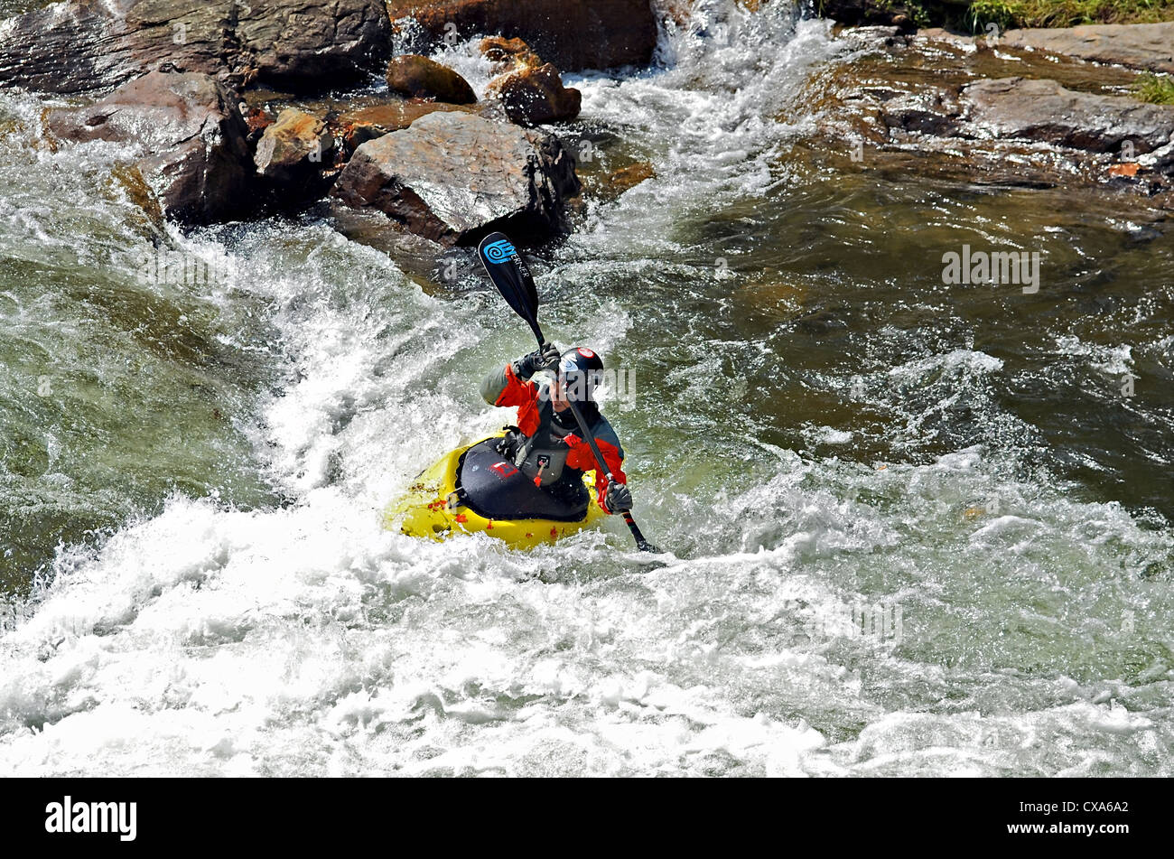BRYSON CITY, NC, USA - SEPTEMBER 12: Unidentified man kayaking the white water rapids of the Nantahala River September 12, 2012. Stock Photo
