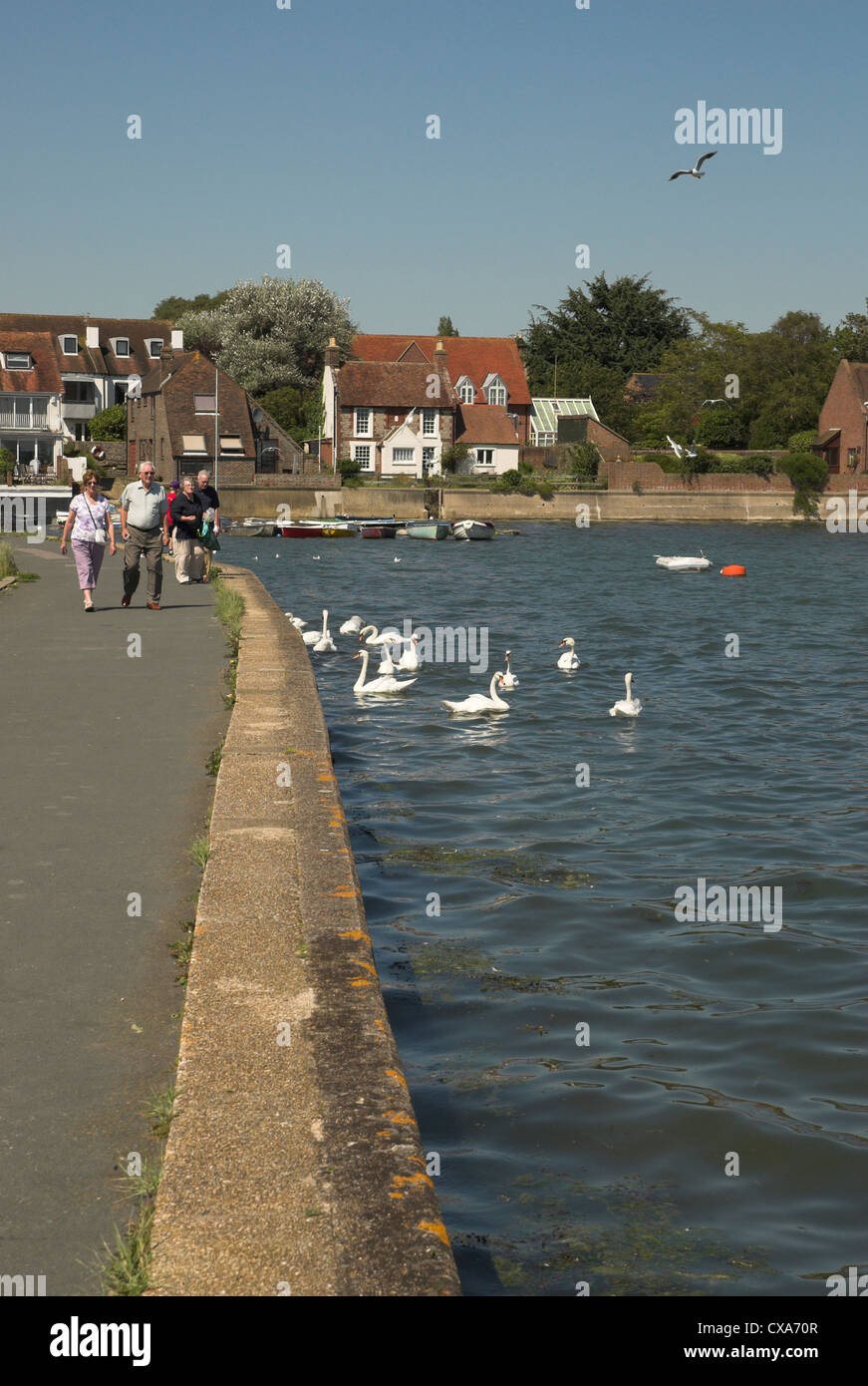 Visitors and tourists enjoy the waterside at Emsworth, Hampshire on the