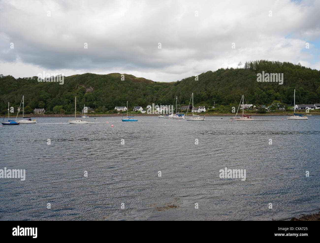 View Across Loch Melfort towards Cuilfail Woods With Moored Yachts from The South Bank Argyll and Bute Scotland Stock Photo