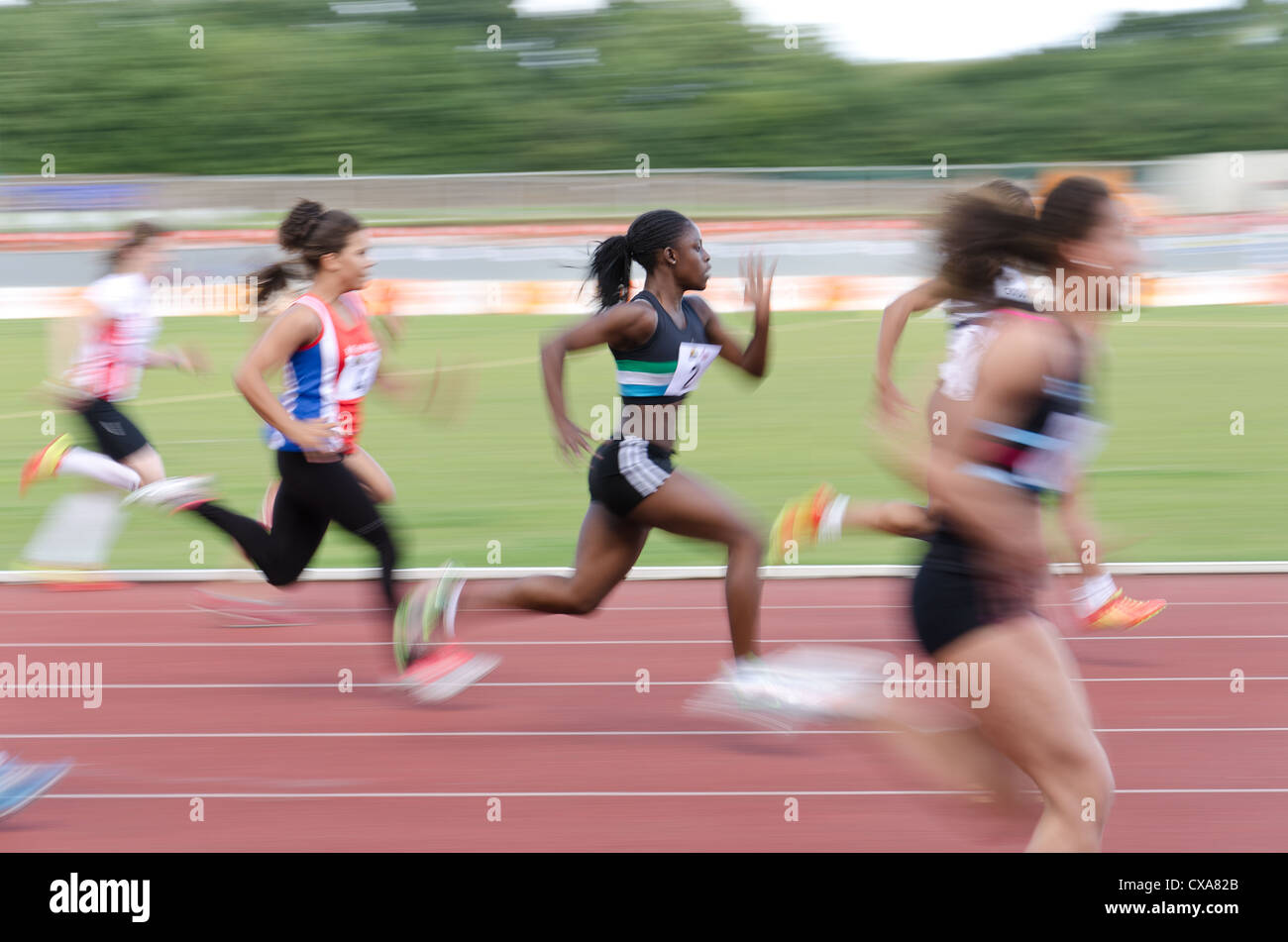Blurred colourful motion and action of track and field events 100m