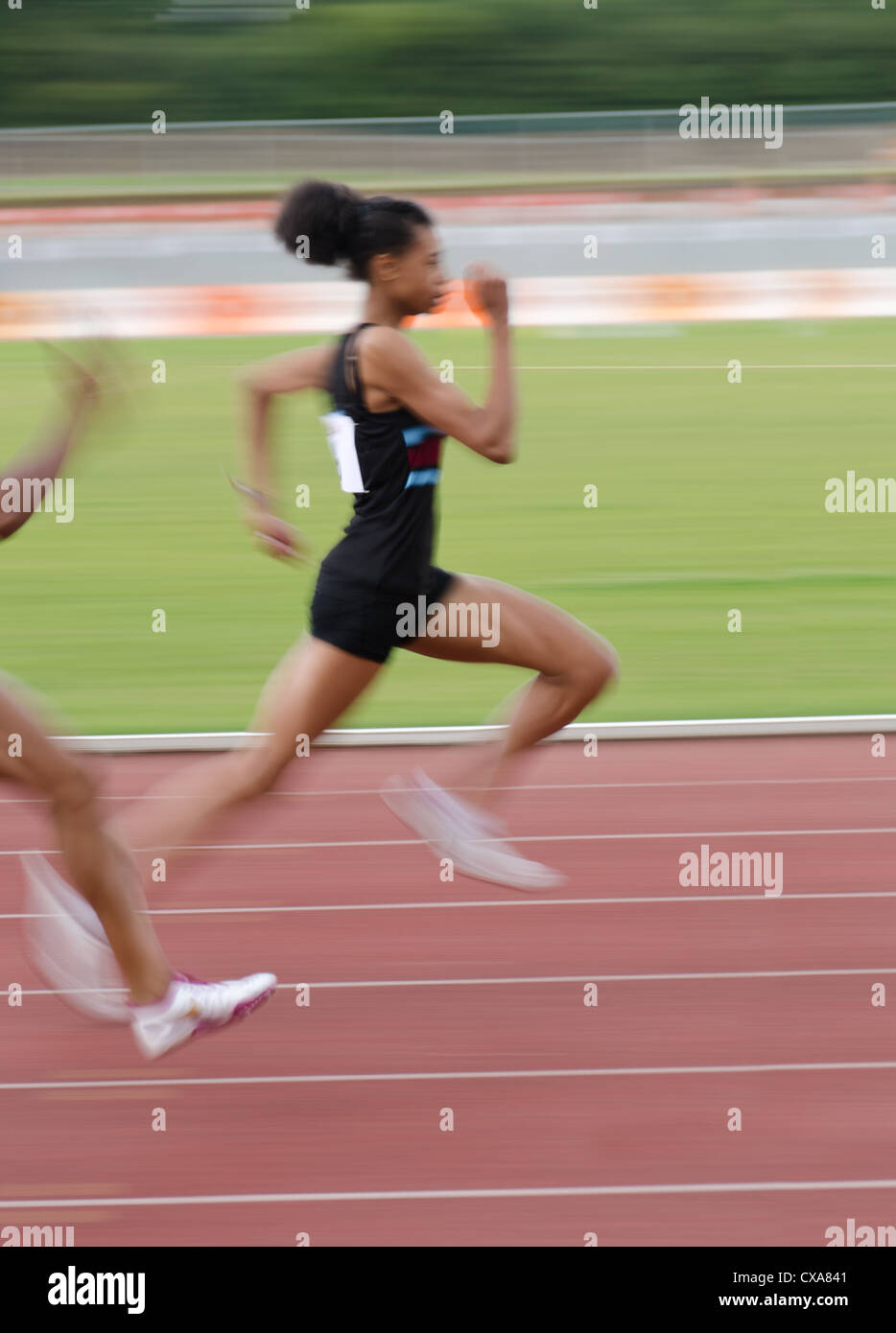 Blurred colourful motion and action of track and field events 100m