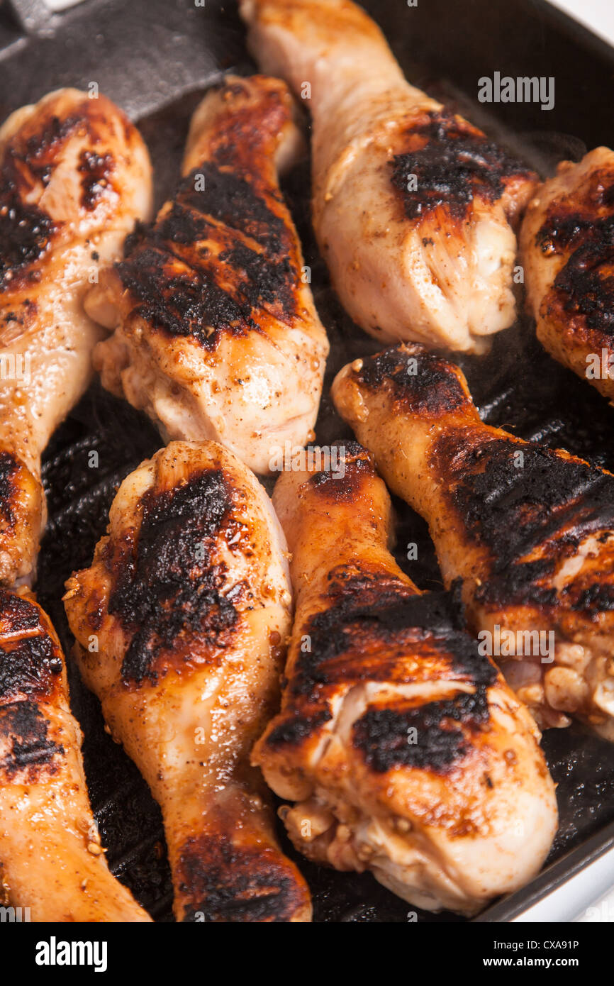 some juicy roast chicken drumstick on frying pan Stock Photo Alamy