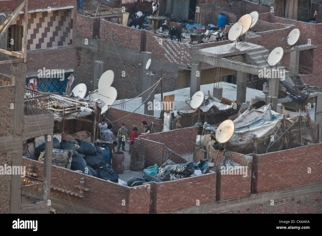 Cairo's largest settlement of garbage people is Mokattam village nicknamed as 'Garbage City,' :the rooftops where garbage sorted Stock Photo