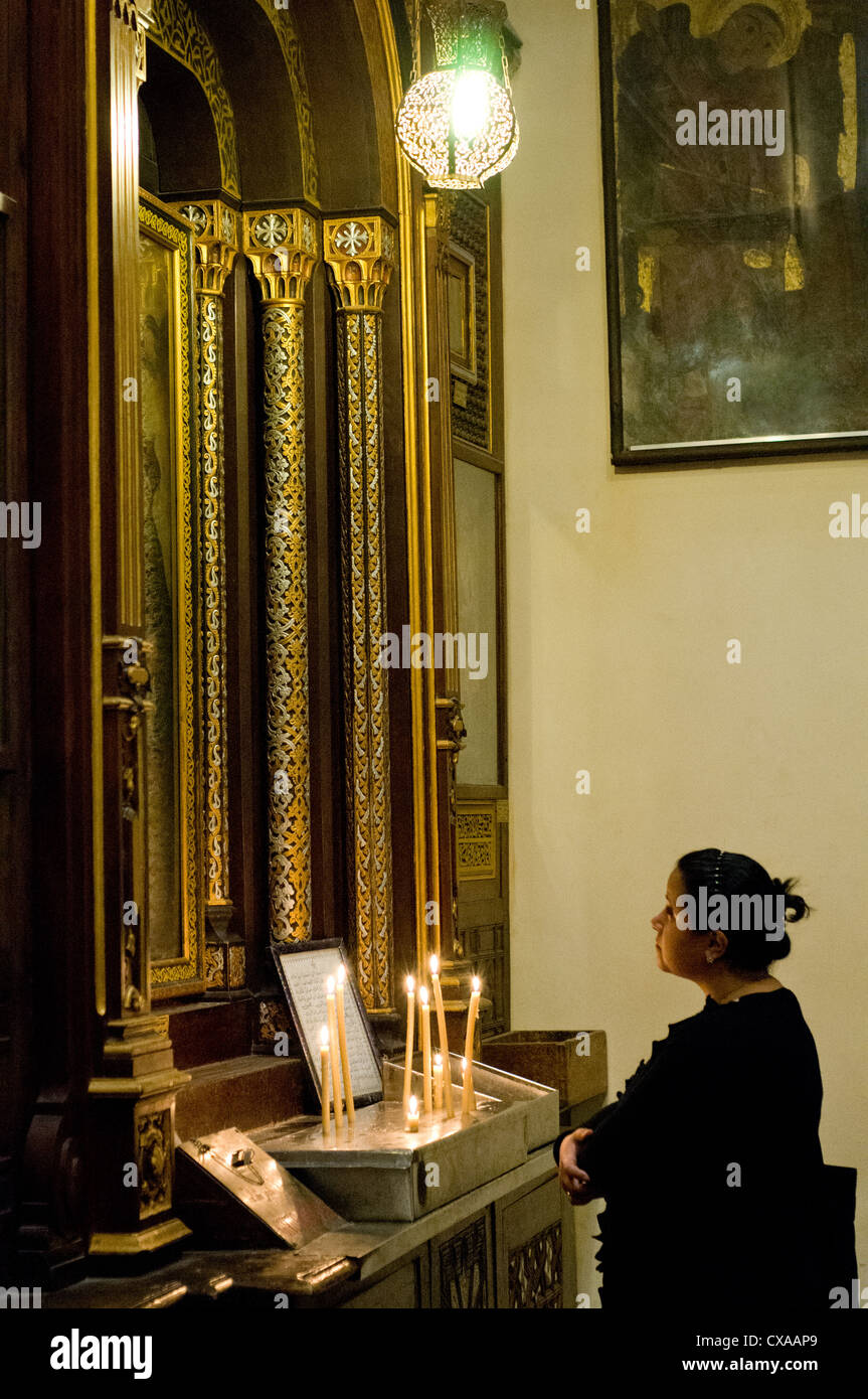 Coptic  Egyptian praying at  the Church of the Virgin, also known as the Hanging Church Cairo Egypt Stock Photo