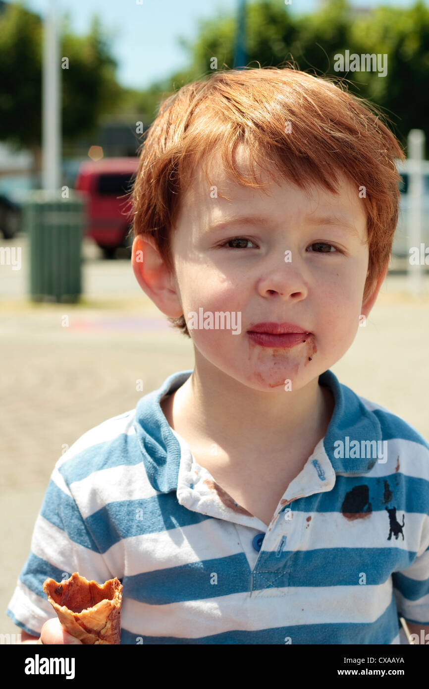 Young boy eating an ice-cream Stock Photo