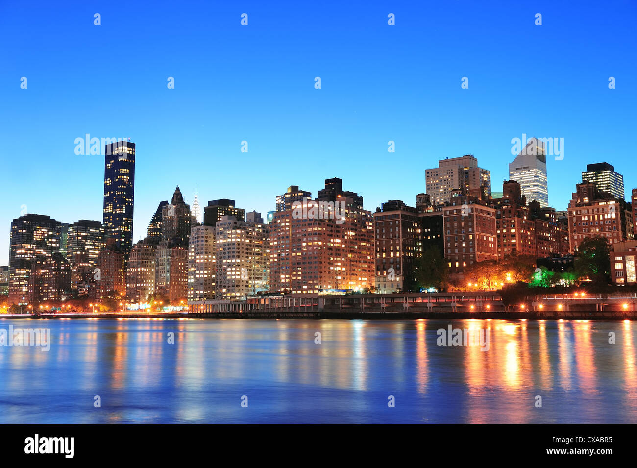 New York City Manhattan midtown skyline at night over East River Stock ...