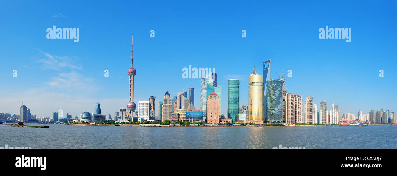 Shanghai skyline panorama with skyscrapers and blue clear sky over Huangpu River. Stock Photo