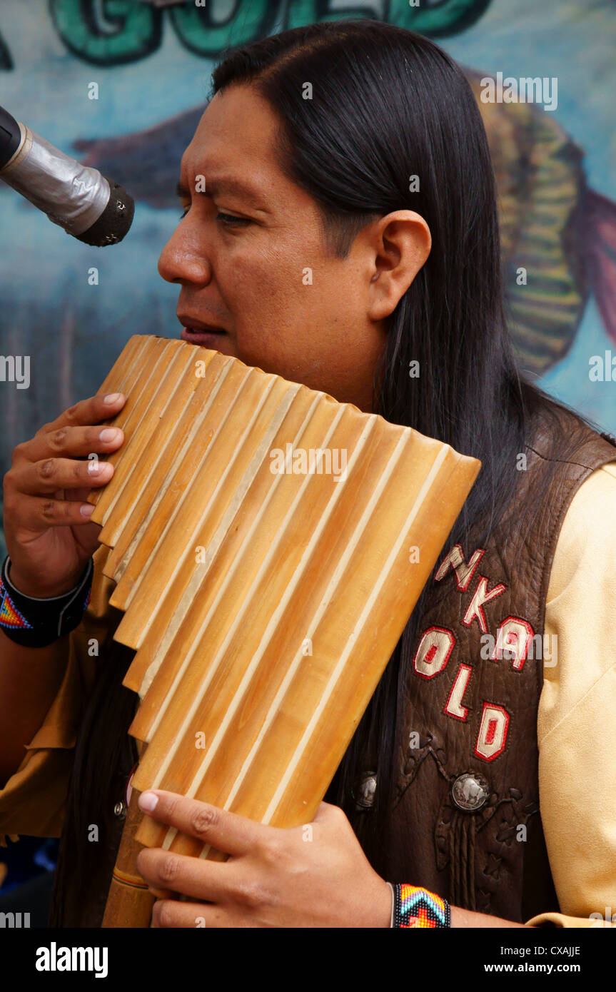 indian native american musician male playing flute inka gold inca music man  human fellow gentleman guy he Stock Photo - Alamy