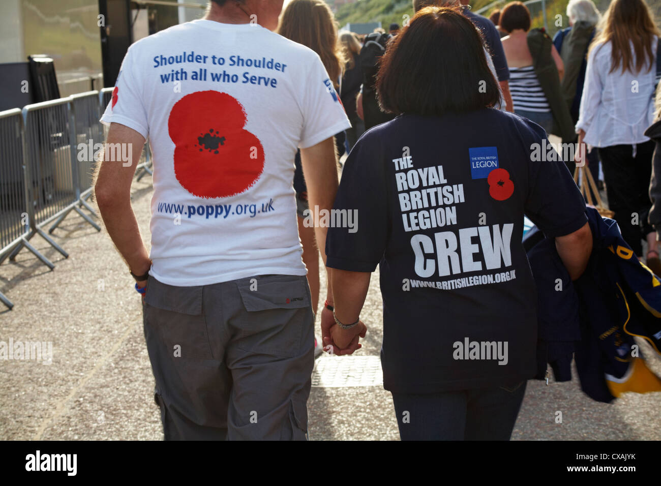 British Legion supporters wearing t-shirts advertising the poppy appeal at Bournemouth, Dorset in August Stock Photo