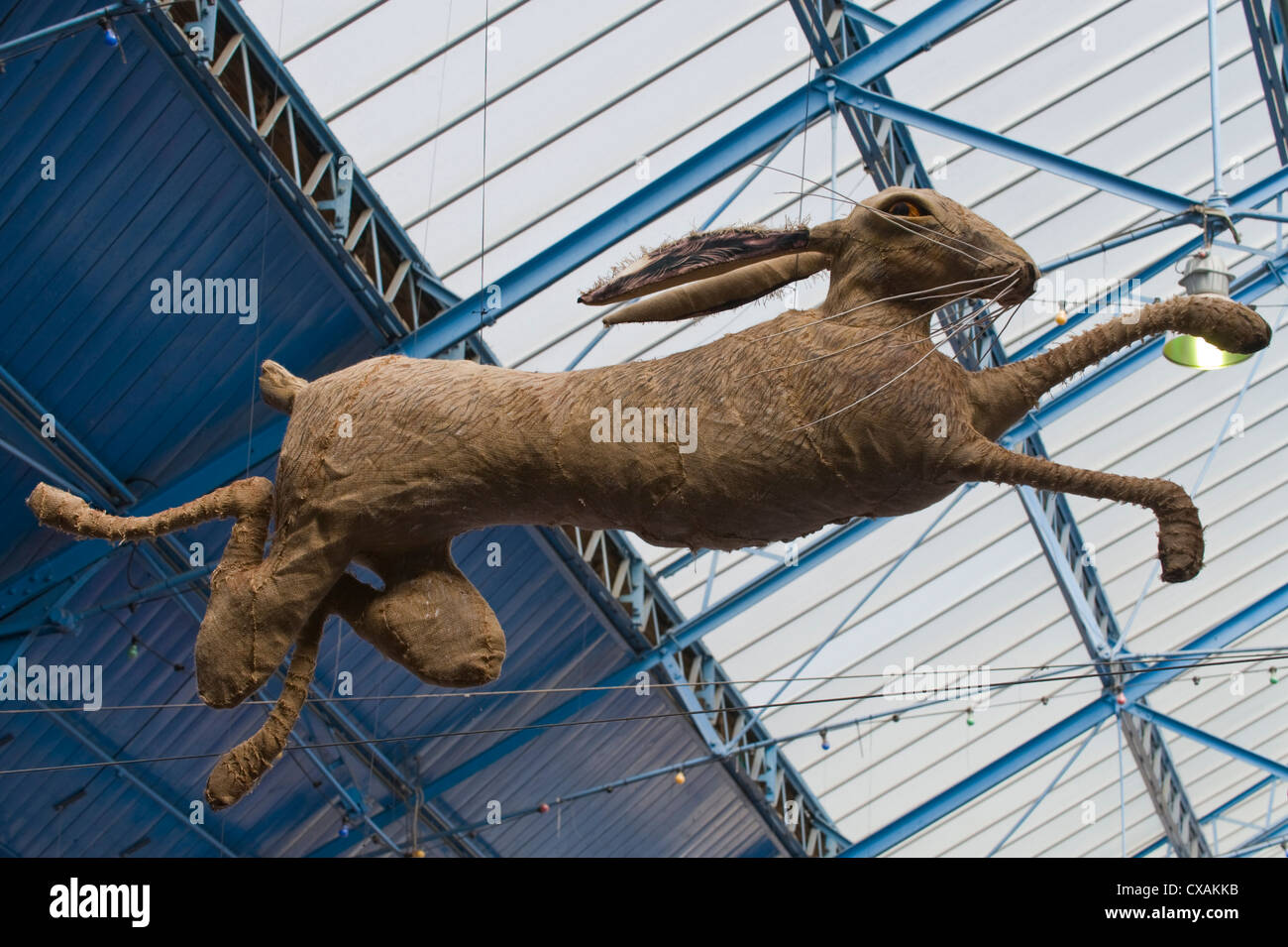 Art installation of leaping hares hanging from the roof of the market hall during Abergavenny Food Festival Stock Photo