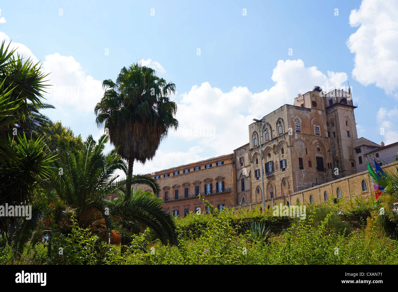 External view of the Palace of Normans of Palermo in Sicily seen through the trees of Villa Bonanno Stock Photo