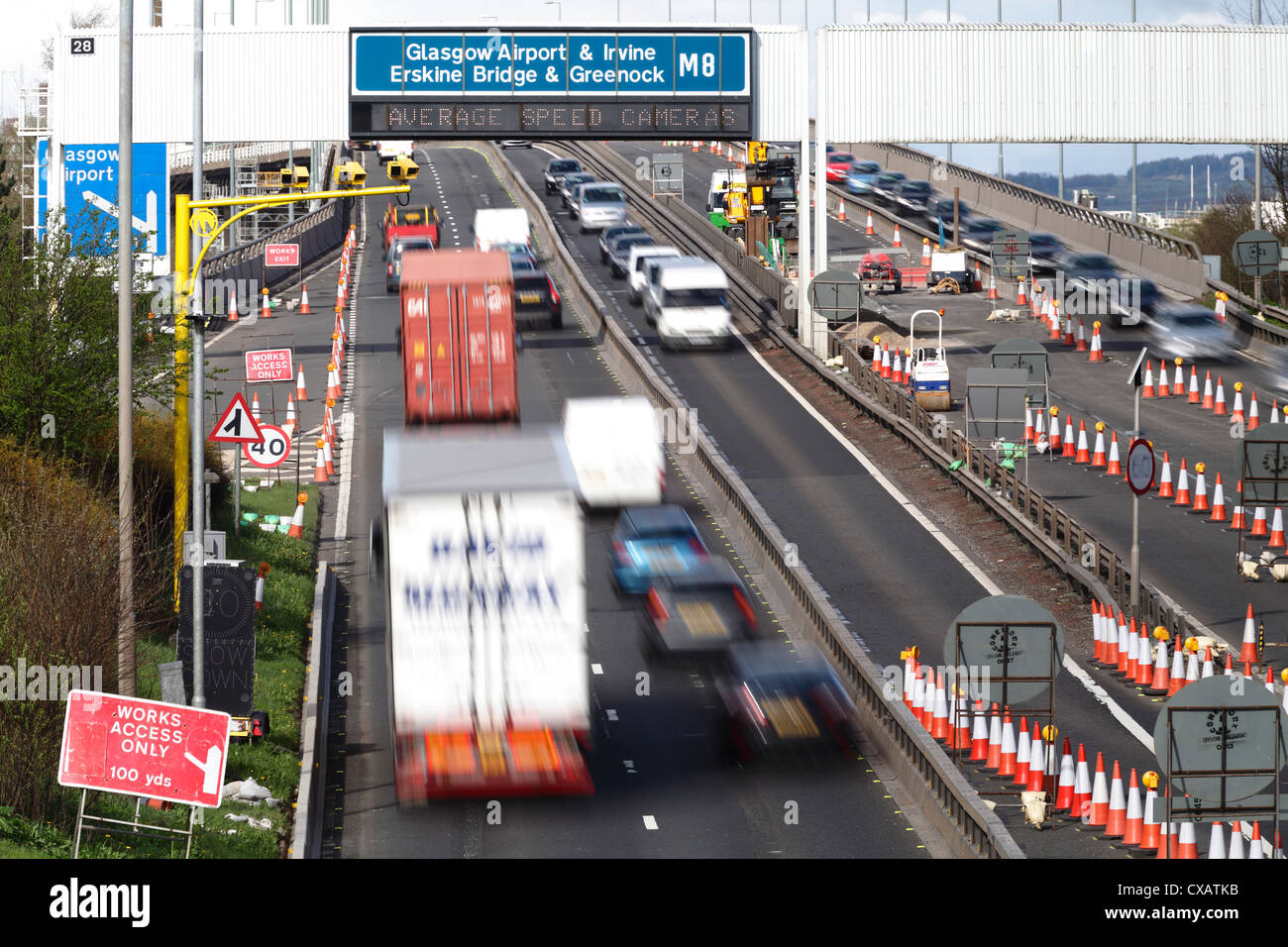 Motion blurred traffic in roadworks with Average Speed Cameras, UK Stock Photo