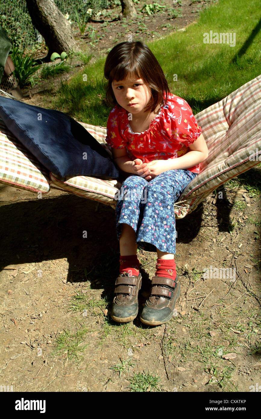 Berlin, a young girl sitting on a hammock Stock Photo