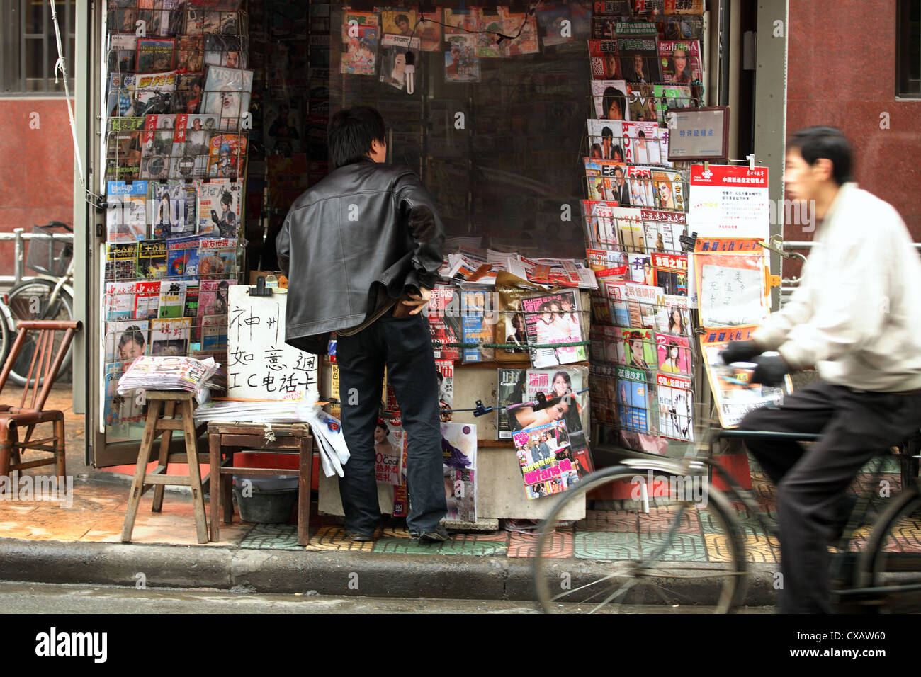 Shanghai, man at a newsstand Stock Photo
