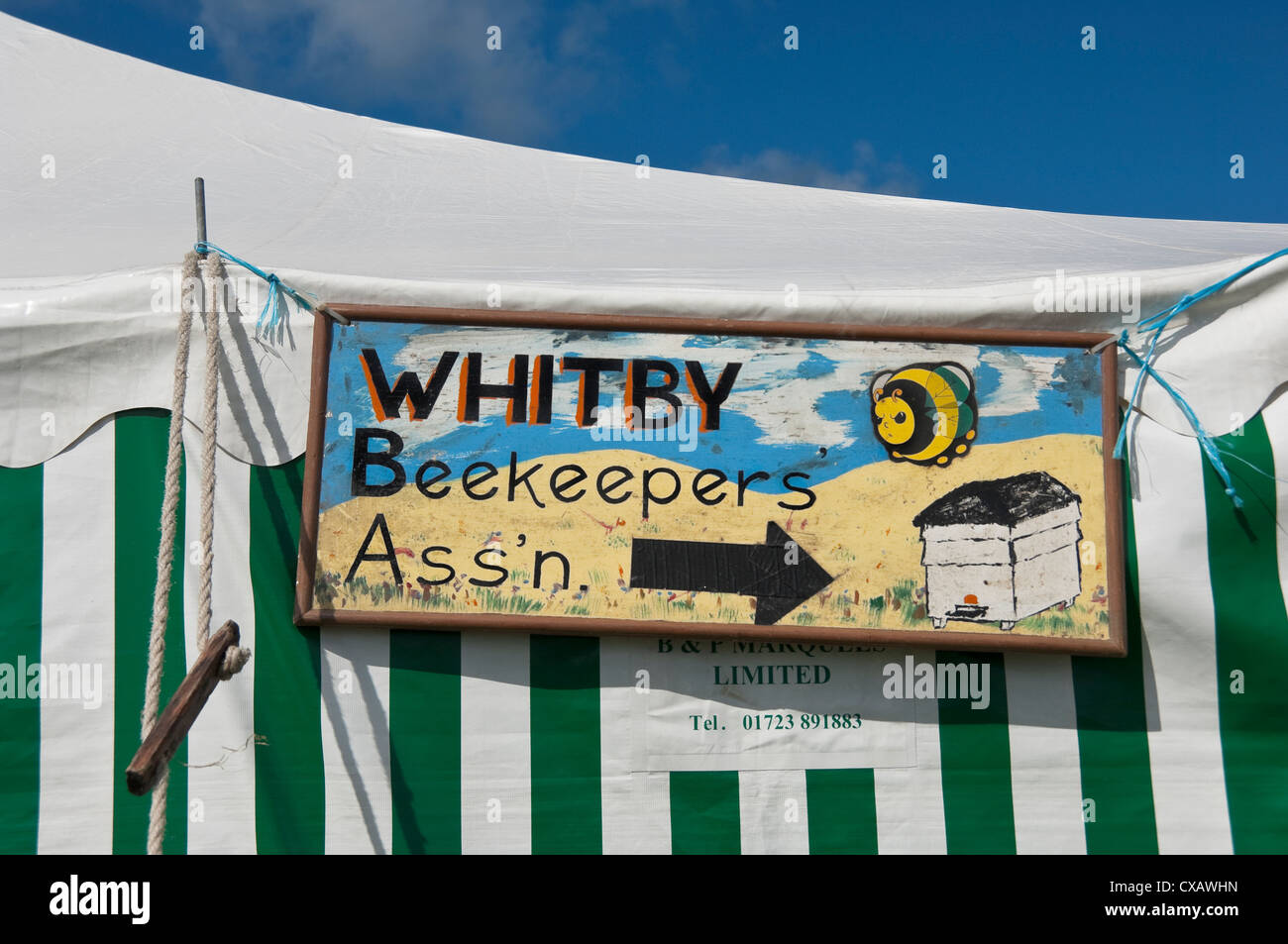 Close up of Whitby Beekeepers Beekeeper Association wooden sign North