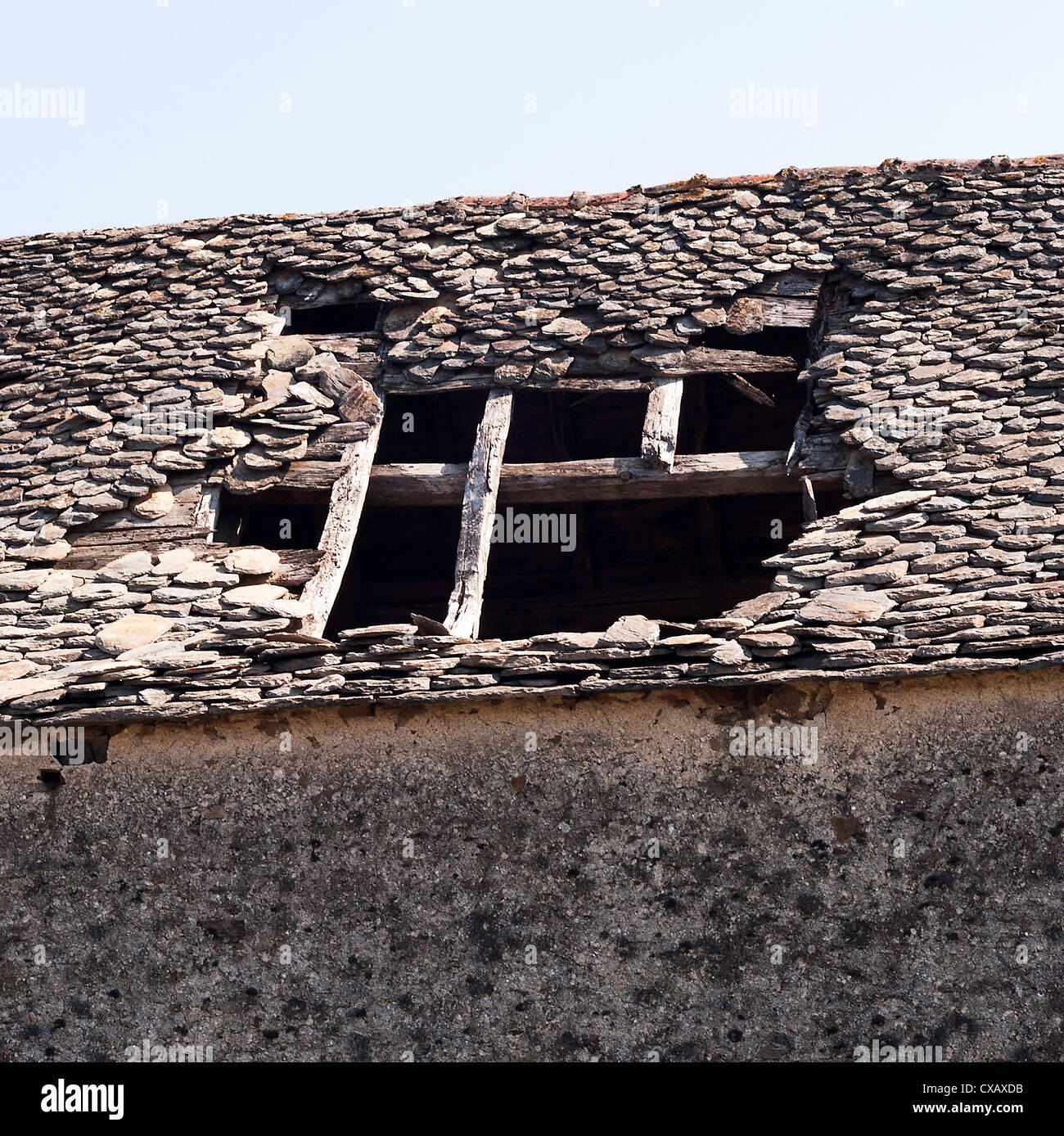 Old Stone Barn Building with Tiled Roof in State of Collapse at Laval near Pradinas Aveyron Midi-Pyrenees France Stock Photo