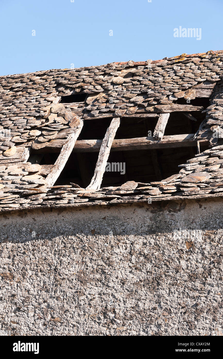 Old Stone Barn Building with Tiled Roof in State of Collapse at Laval near Pradinas Aveyron Midi-Pyrenees France Stock Photo