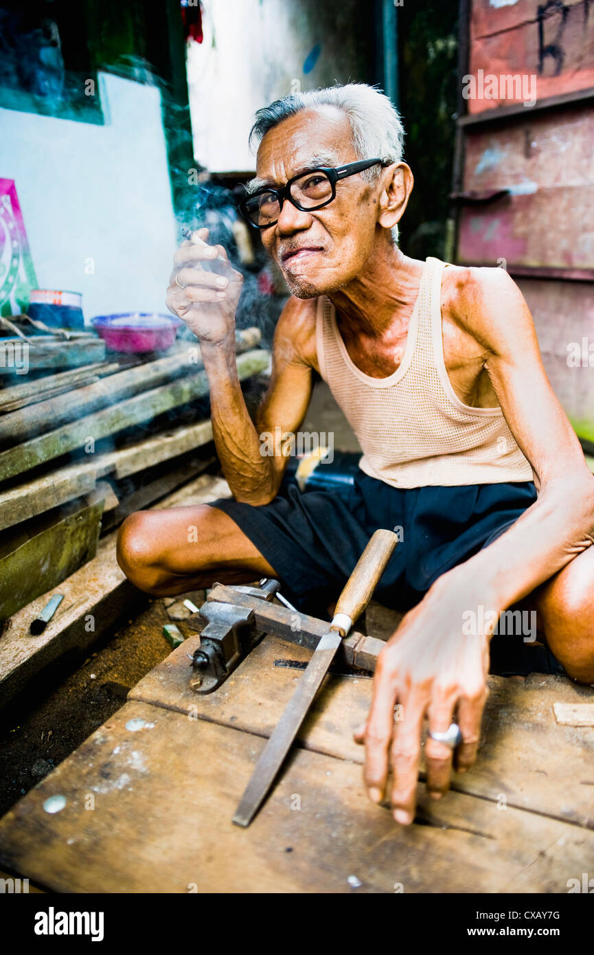 Portrait of an Indonesian carpenter man at Taman Sari, Water Castle, Yogyakarta, Central Java, Indonesia, Southeast Asia, Asia Stock Photo