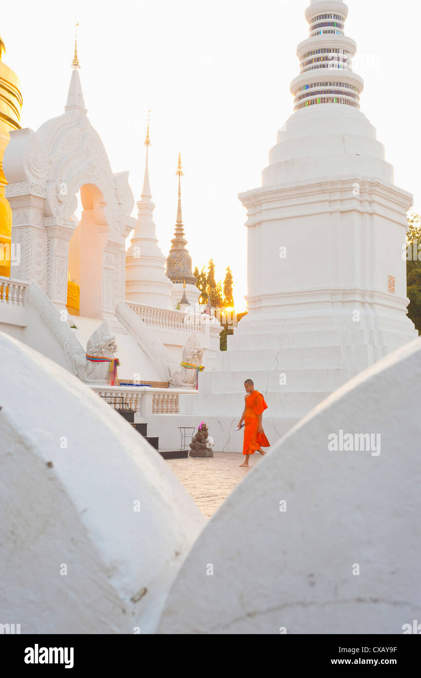 Buddhist monk walking around Wat Suan Dok Temple in Chiang Mai, Thailand, Southeast Asia, Asia Stock Photo