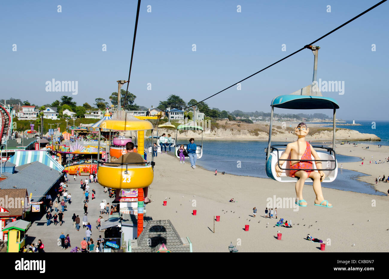 Fairground rides and crowds on Santa Cruz boardwalk, California Stock Photo