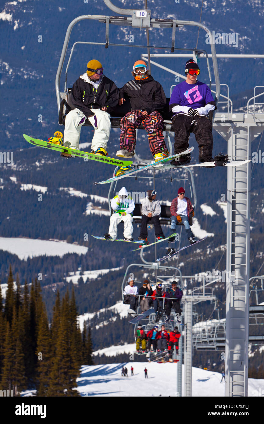 Chairlift carrying skiers and snowboarders, Whistler Mountain, Whistler