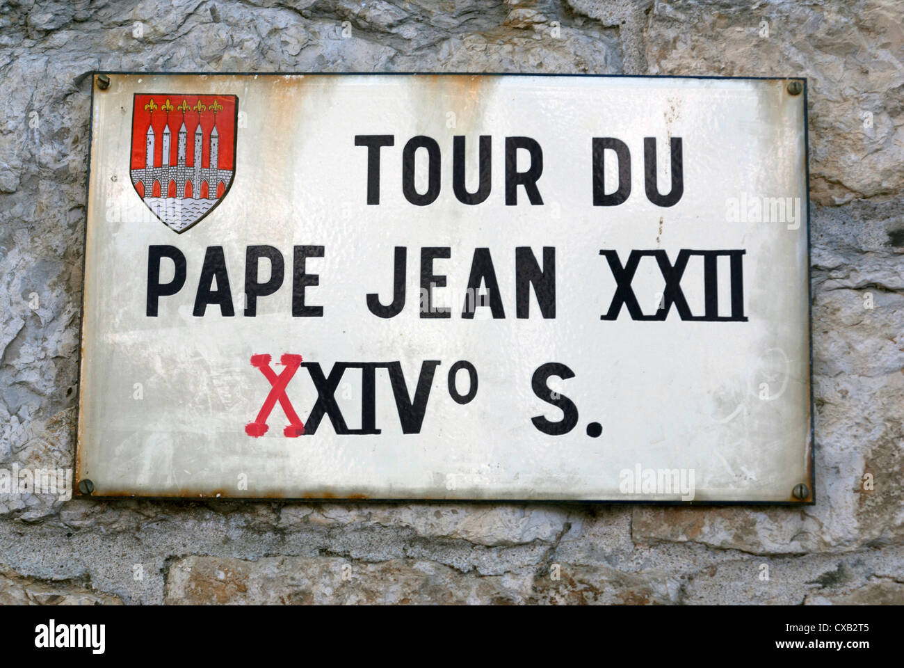 Wall sign marking The Tour du Pape Jean XXII next to Saint-Barthélémy church in Cahors, France Stock Photo